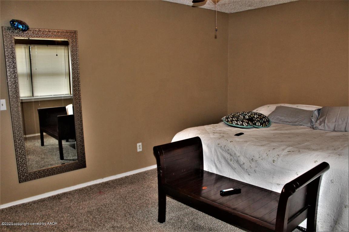 4354 South Polk Street Amarillo, TX 79110 - Photo 10 of 12 a bedroom with a bed and furniture