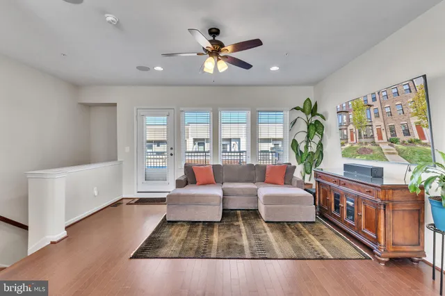 a living room with furniture and a rug