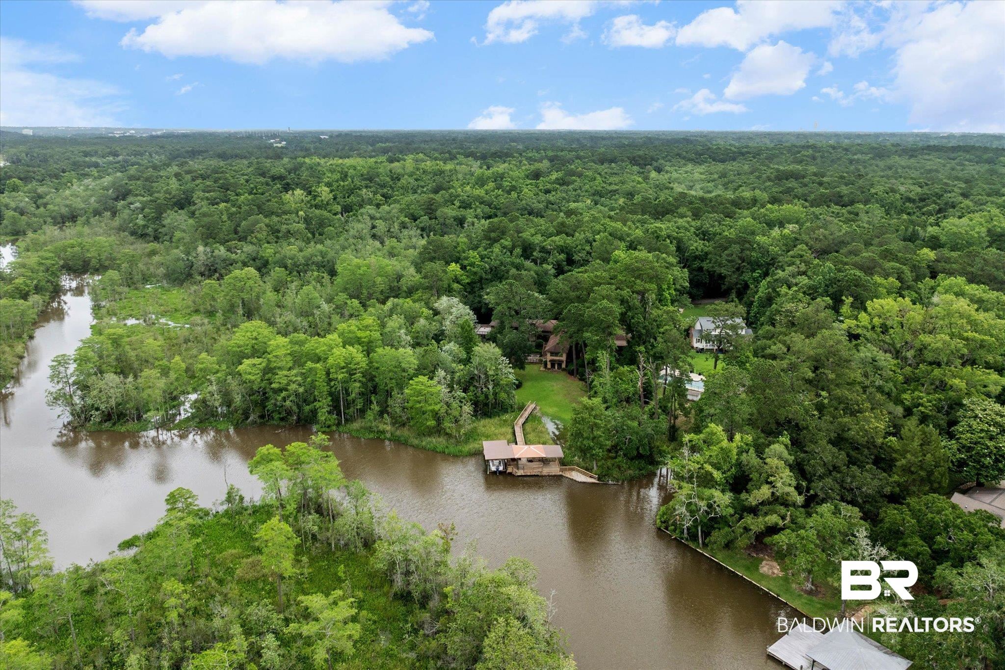 3500 Venetia Road Mobile, AL 36605 - Photo 46 of 56 Riverfront property featuring a private boat dock, lush green surroundings, and expansive wooded acreage