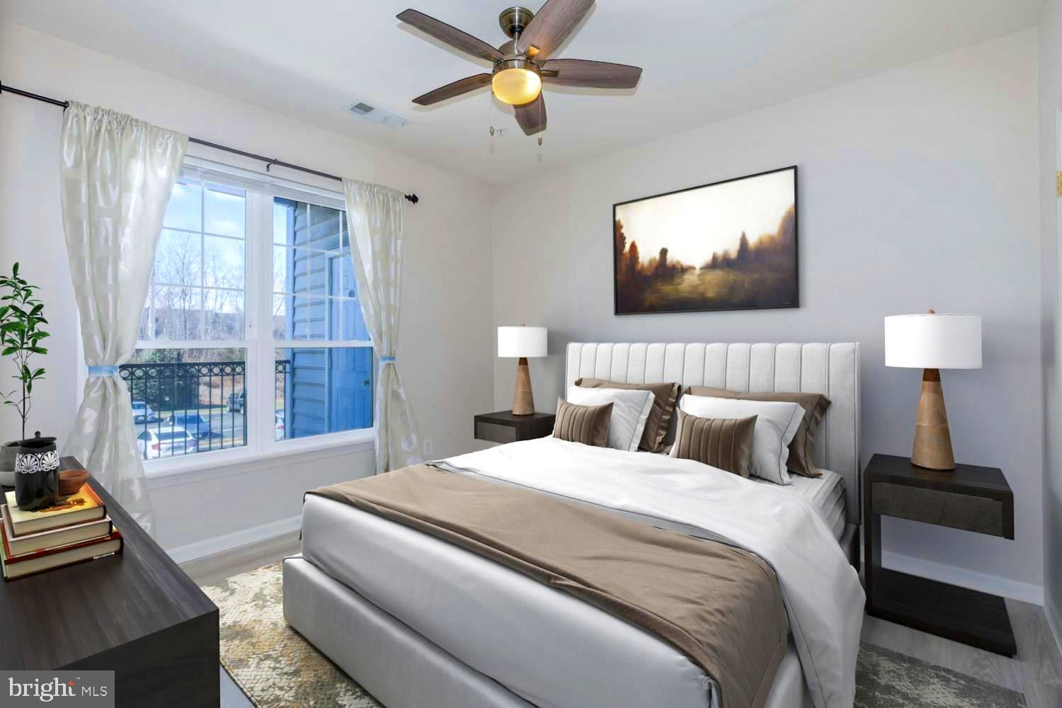 1530 Spring Gate Dr., Unit 9213 McLean, VA 22102 - Photo 11 of 24 a bedroom with bed and a chandelier