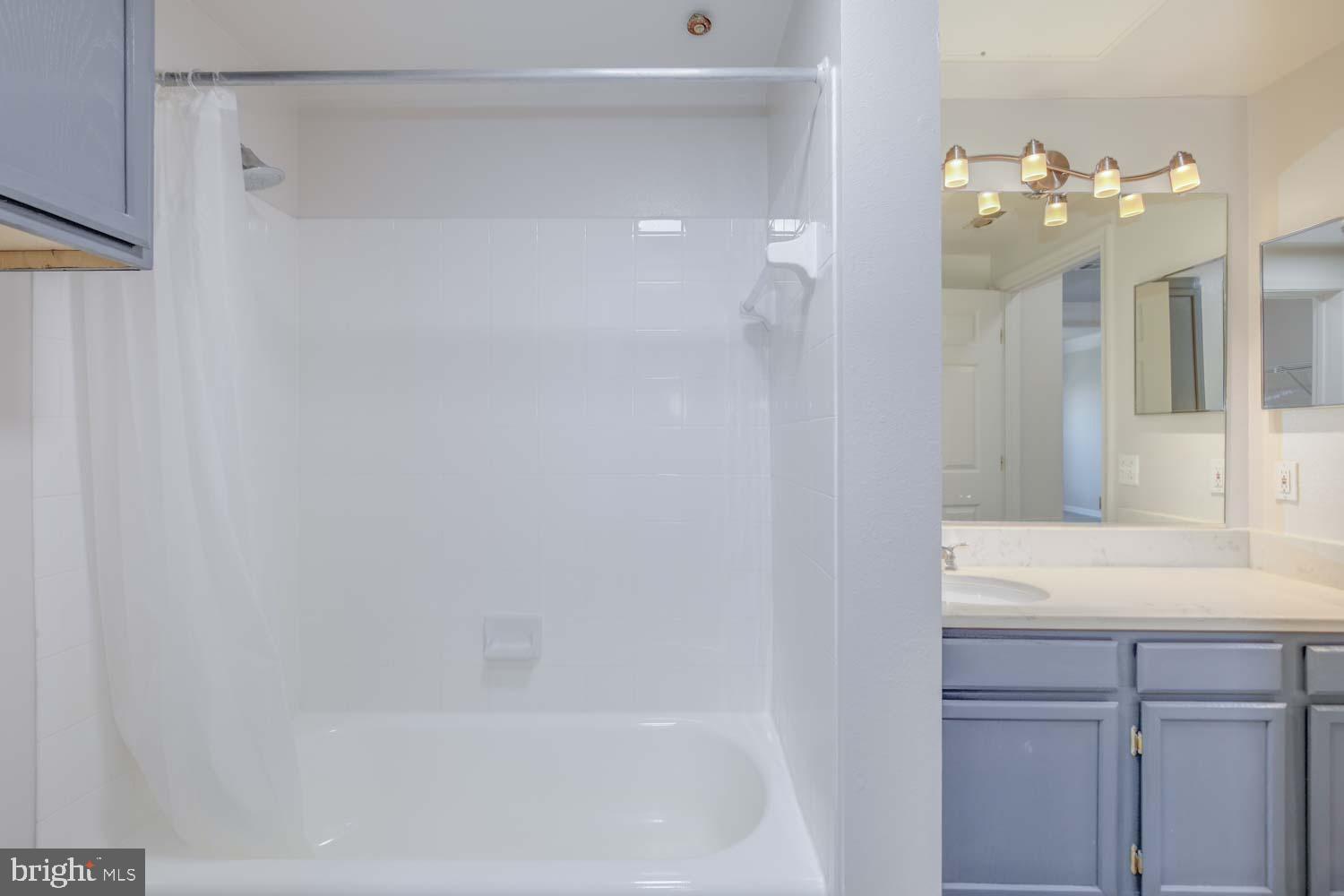 1530 Spring Gate Dr., Unit 9213 McLean, VA 22102 - Photo 15 of 24 a bathroom with a sink vanity and a mirror