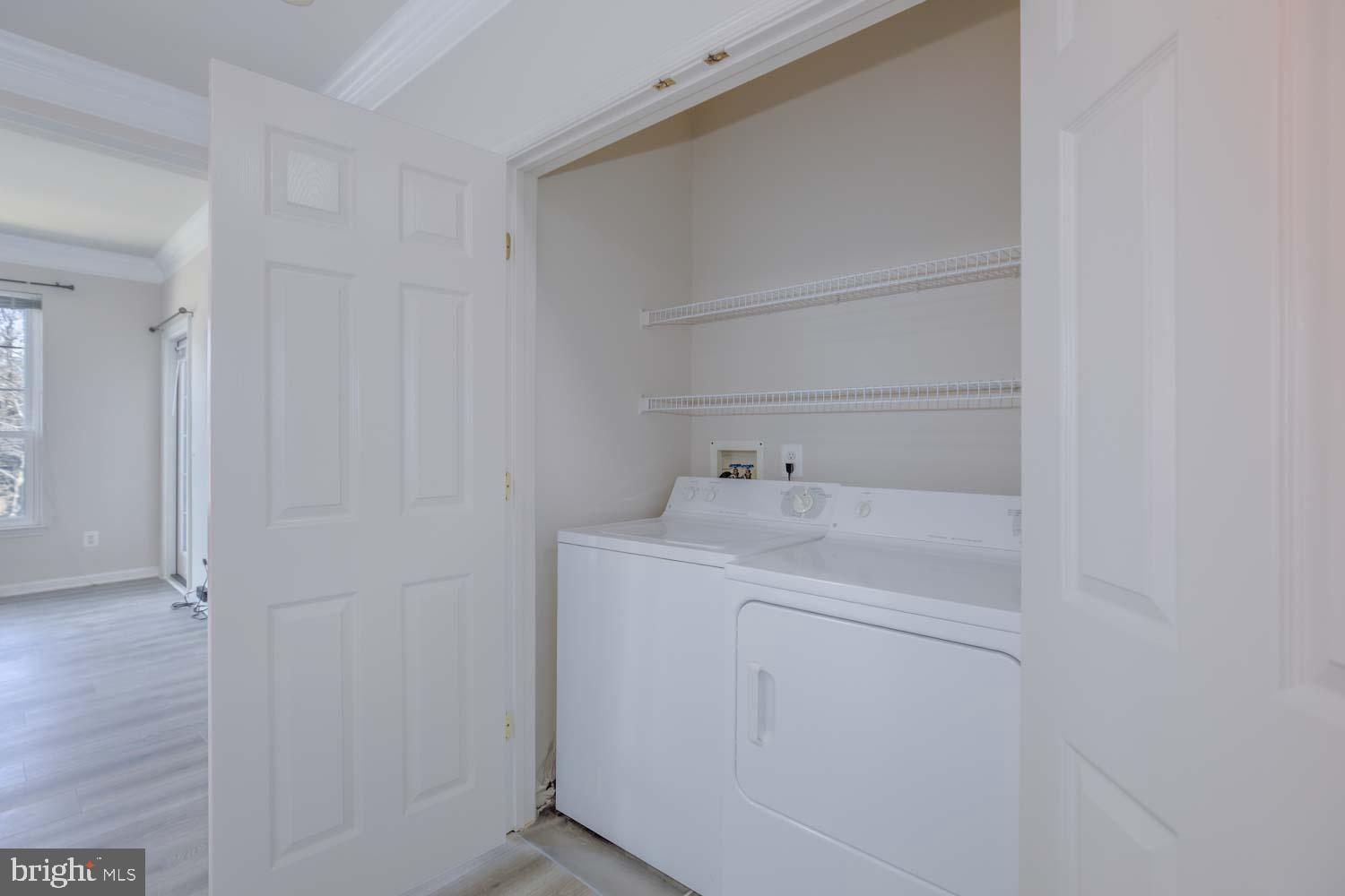1530 Spring Gate Dr., Unit 9213 McLean, VA 22102 - Photo 17 of 24 a utility room with dryer and washer