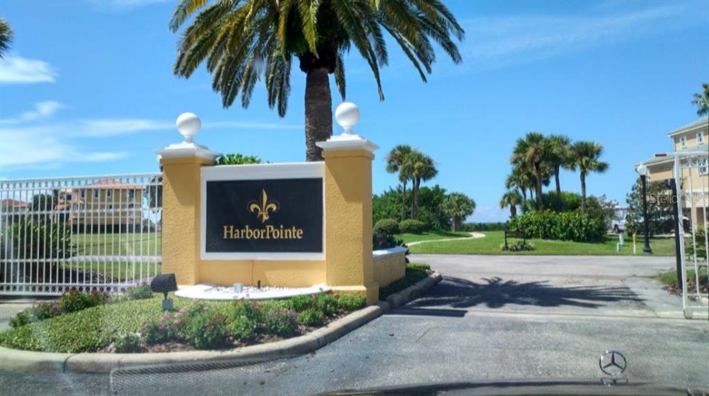 25 Harborpointe Drive Port Richey, FL 34668 - Photo 17 of 21 a view of a house with a yard and potted plants