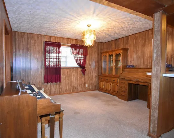 a room with furniture pool table and flat screen tv