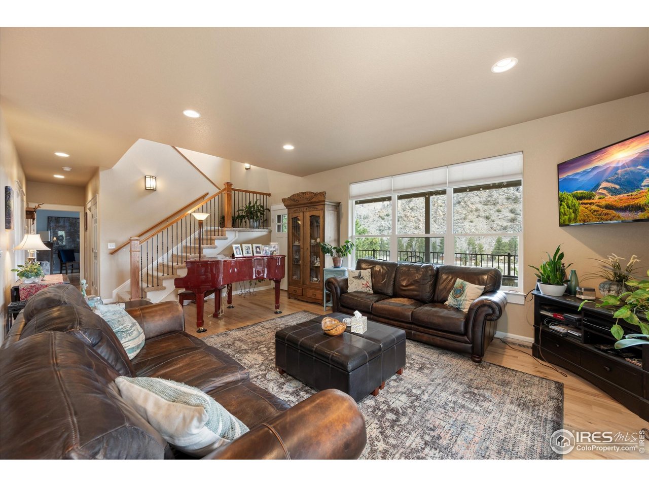 229 Rustic Road Bellvue, CO 80512 - Photo 18 of 50 a living room with furniture and a large window