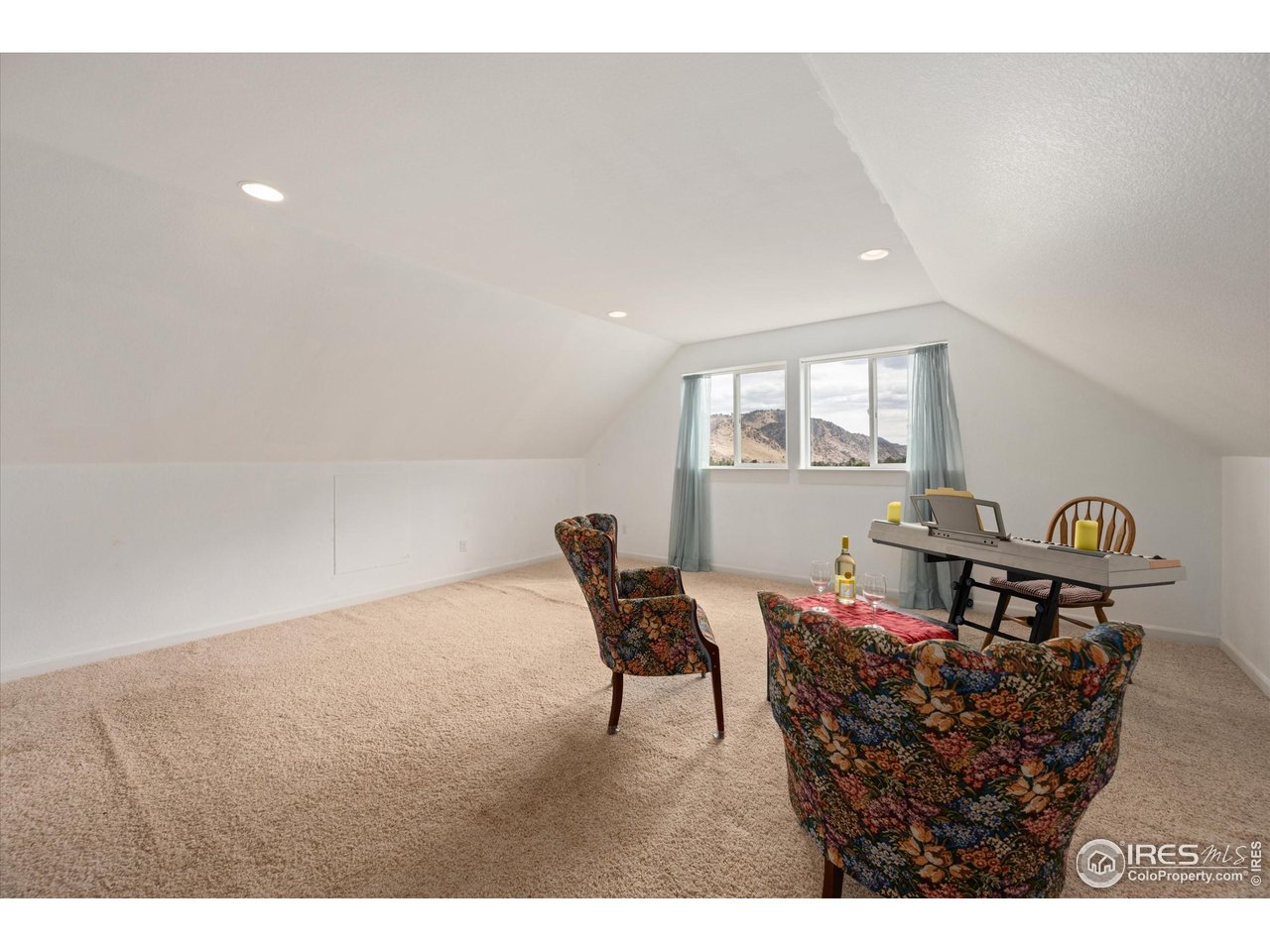 229 Rustic Road Bellvue, CO 80512 - Photo 38 of 50 a living room with furniture and a window