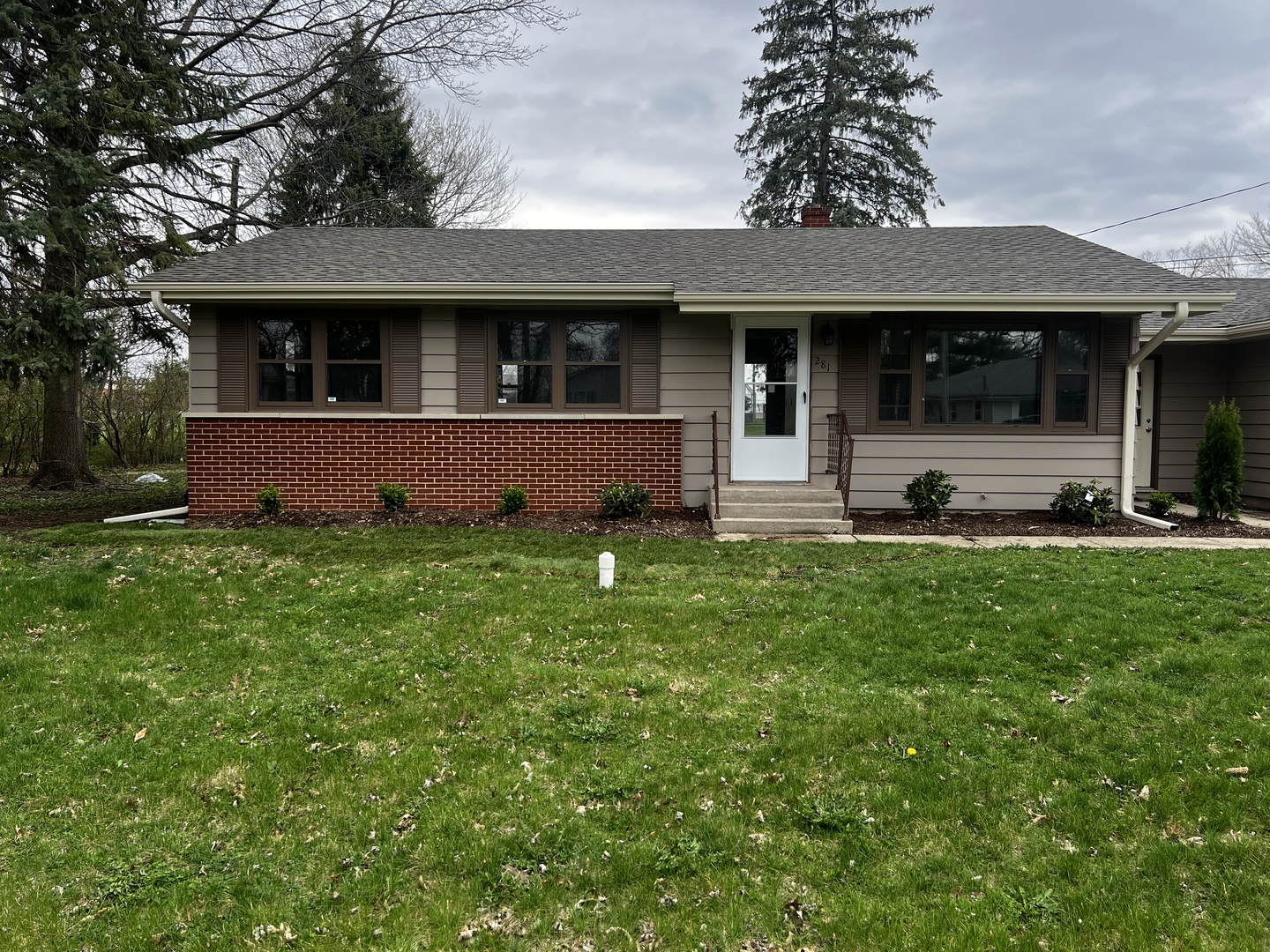 281 Chicago Road Oswego, IL 60543 - Photo 1 of 16 a front view of a house with a garden