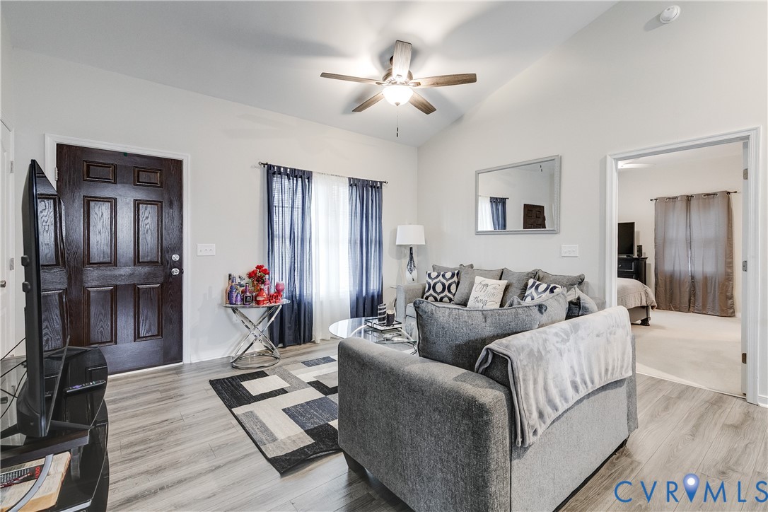 10525 Amelia Springs Road Jetersville, VA 23083 - Photo 21 of 25 a living room with furniture and a wooden floor