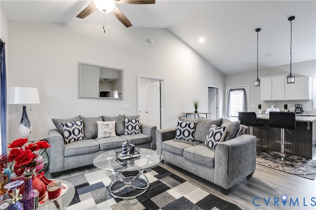 10525 Amelia Springs Road Jetersville, VA 23083 - Photo 22 of 25 a living room with furniture and a chandelier