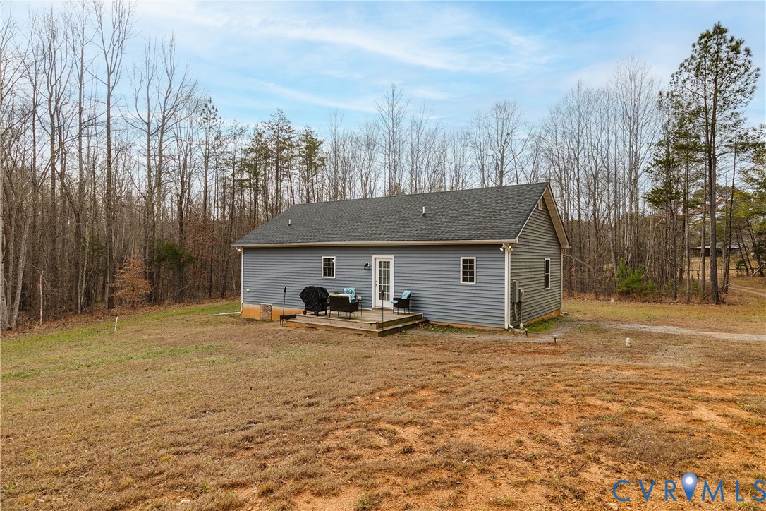 10525 Amelia Springs Road Jetersville, VA 23083 - Photo 24 of 25 a view of a house with backyard and trees