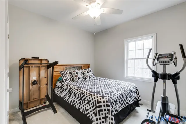 a bedroom with bed and window