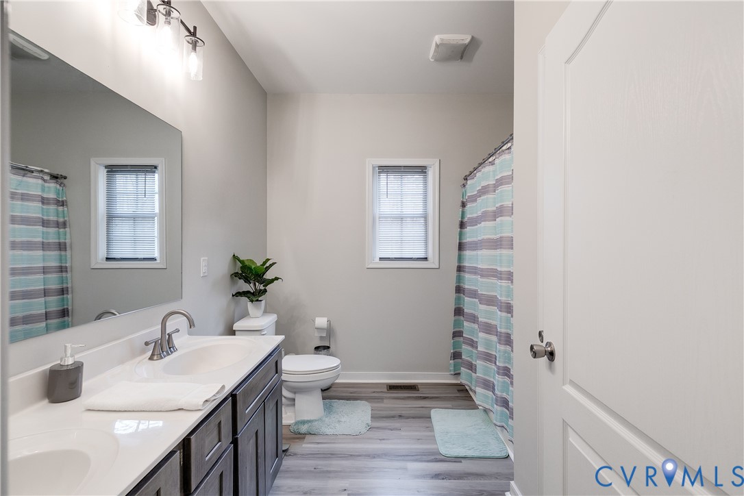 10525 Amelia Springs Road Jetersville, VA 23083 - Photo 8 of 25 a bathroom with a sink and a mirror