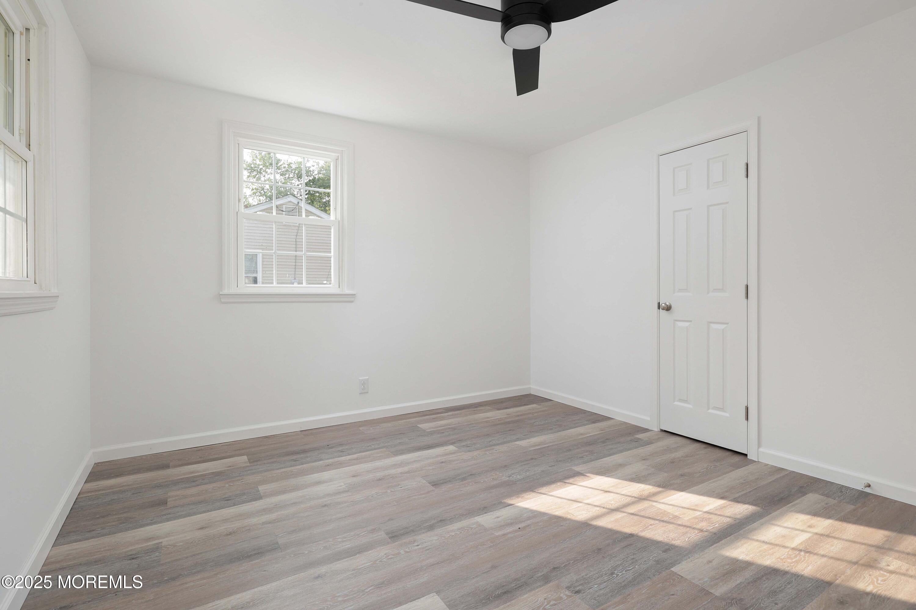 912 Pemberton Browns Mills Road Pemberton, NJ 08068 - Photo 15 of 28 wooden floor in an empty room with a window