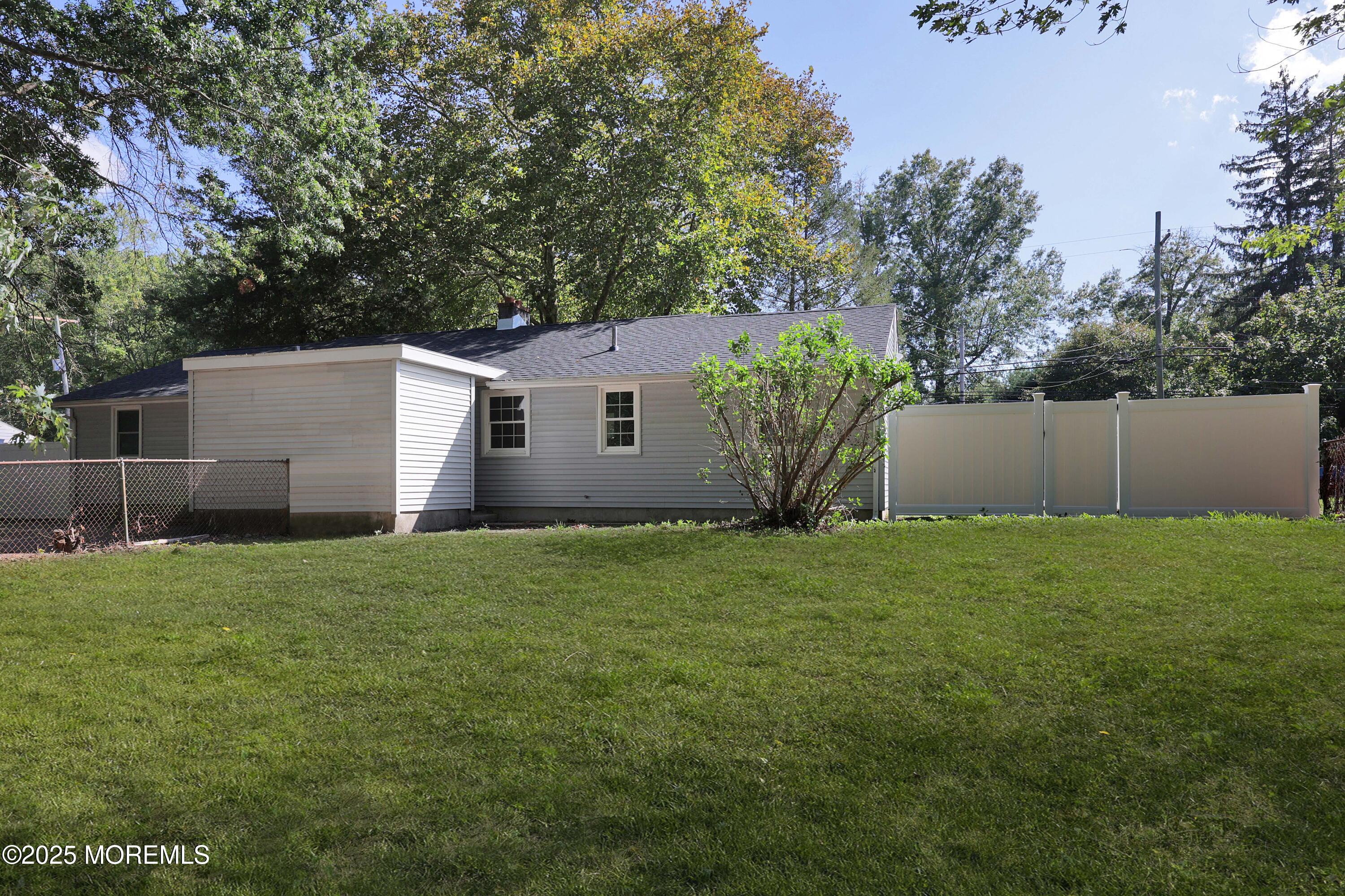 912 Pemberton Browns Mills Road Pemberton, NJ 08068 - Photo 19 of 28 a view of a backyard with potted plants and large tree