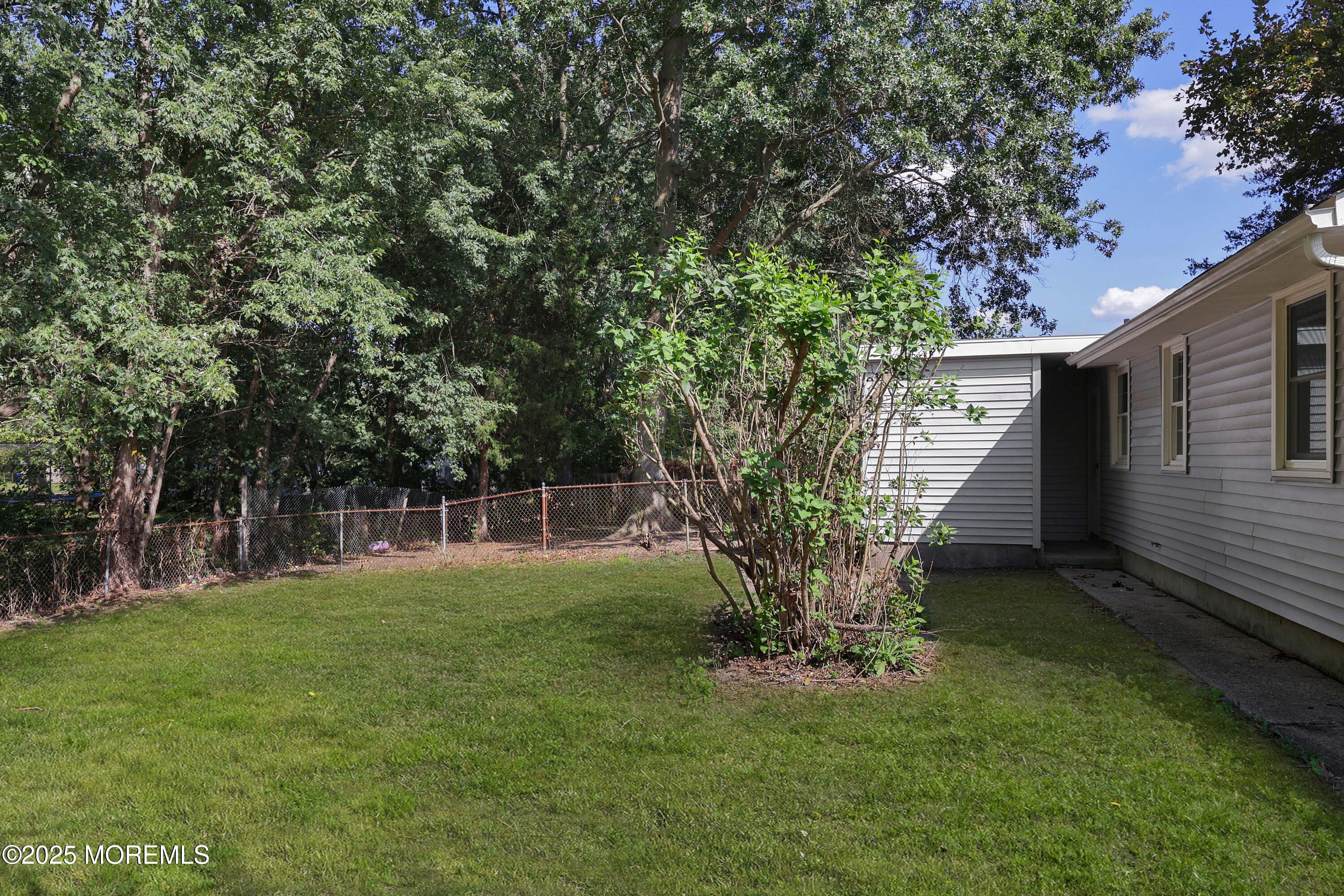 912 Pemberton Browns Mills Road Pemberton, NJ 08068 - Photo 21 of 28 a backyard of a house with table and chairs