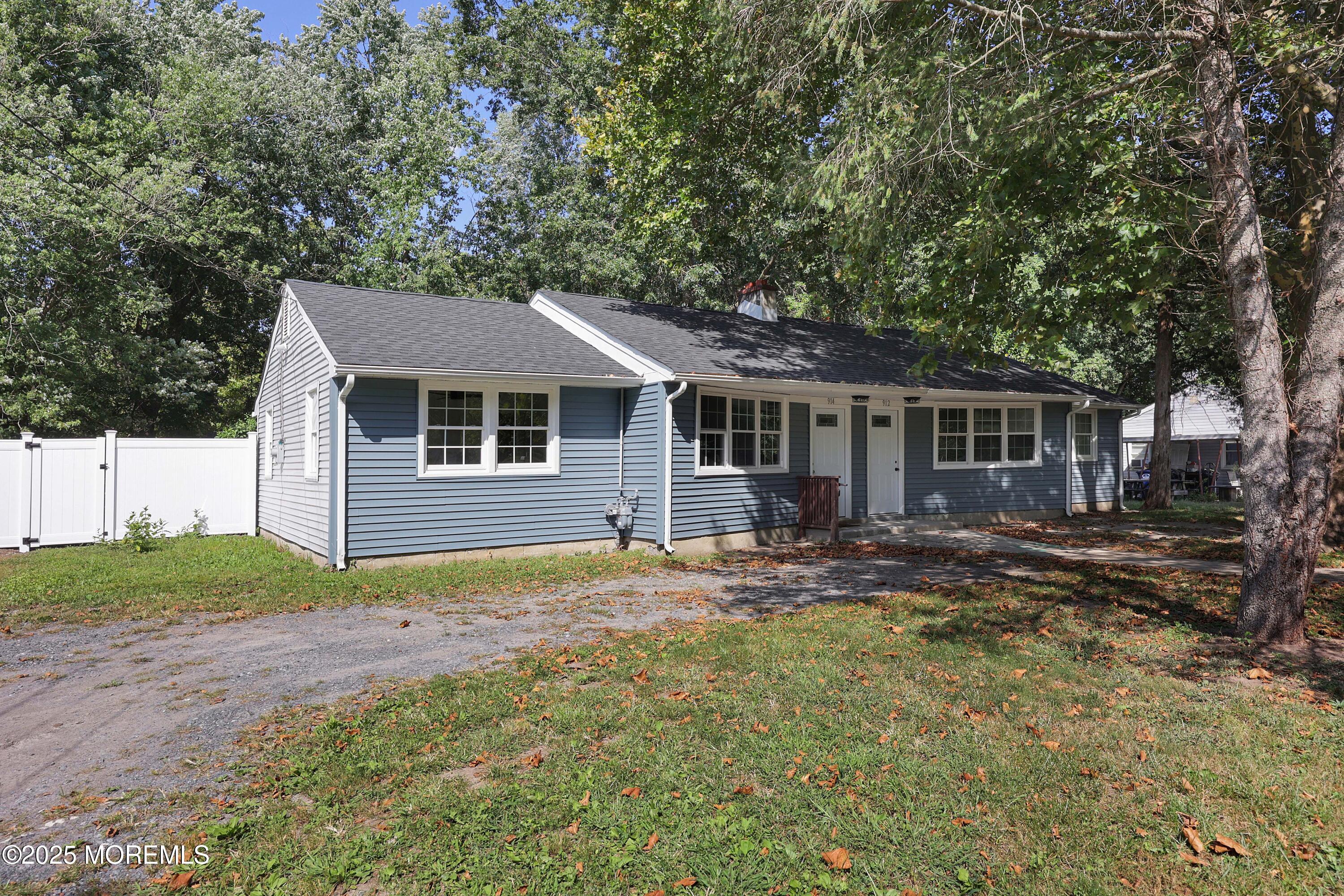 912 Pemberton Browns Mills Road Pemberton, NJ 08068 - Photo 23 of 28 a front view of a house with a garden