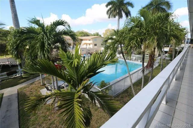 a view of balcony with a palm tree