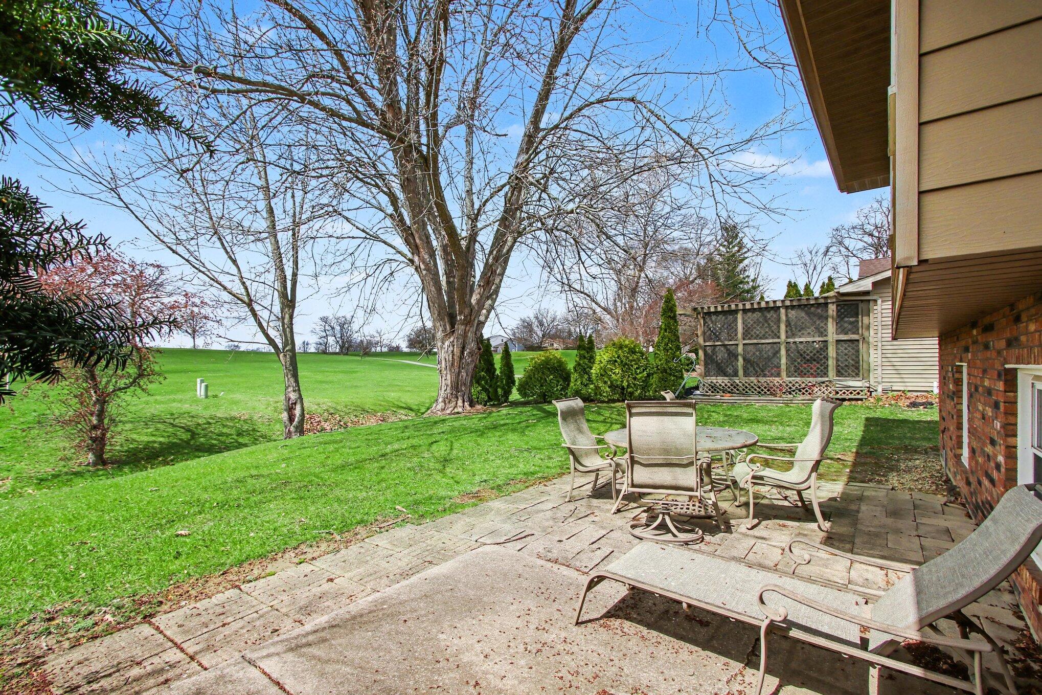 1379 Leeward Road Crown Point, IN 46307 - Photo 29 of 39 a view of a backyard with sitting area