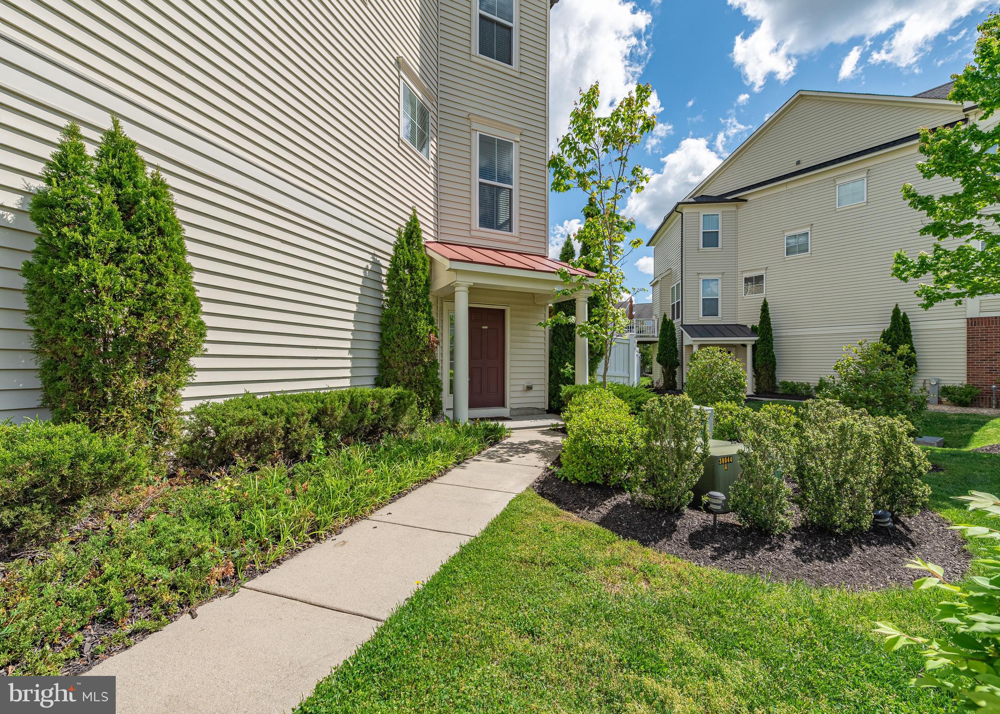 9830 Garden Ranges Laurel, MD 20723 - Photo 15 of 34 a front view of a house with a yard