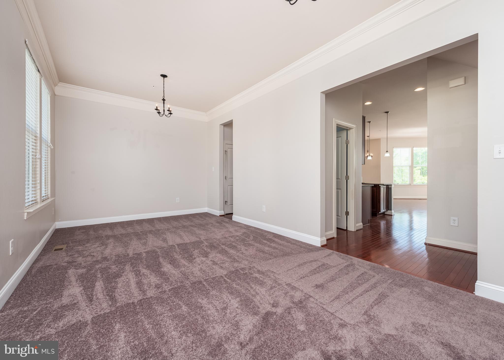 9830 Garden Ranges Laurel, MD 20723 - Photo 6 of 34 a view of a big room with wooden floor and a window