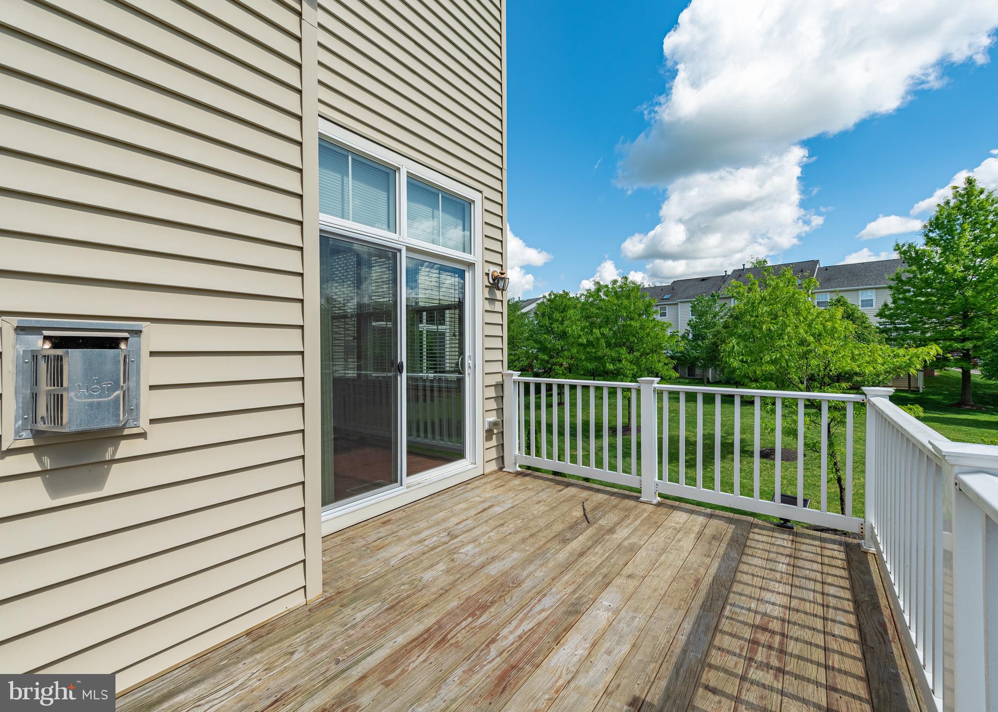 9830 Garden Ranges Laurel, MD 20723 - Photo 8 of 34 a view of a balcony with wooden floor and fence and floor