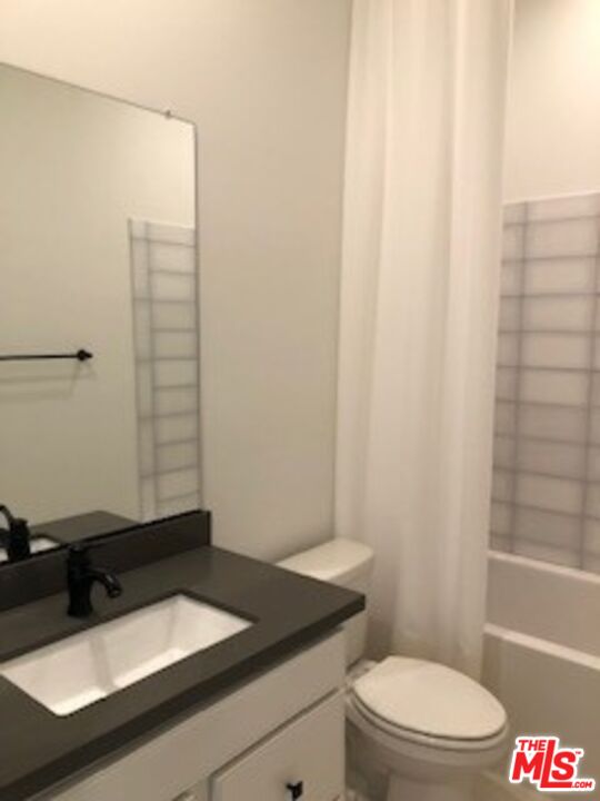 527 Daniel Freeman Circle Inglewood, CA 90301 - Photo 16 of 36 a bathroom with a sink a toilet and shower