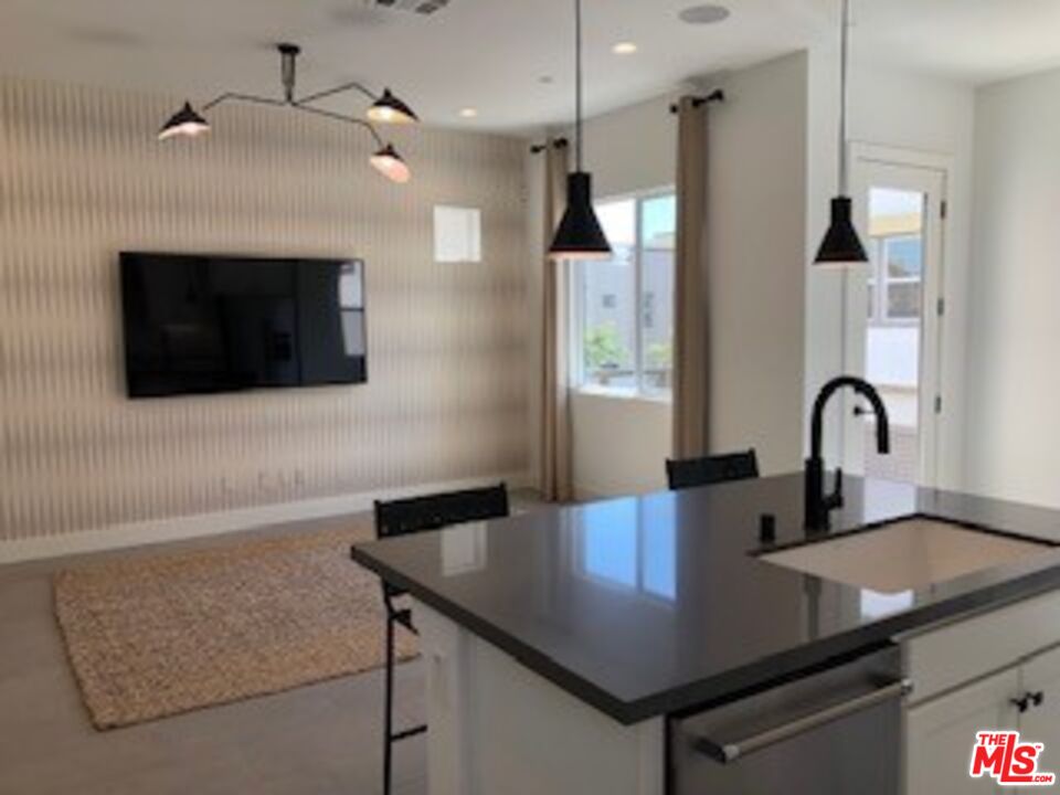 527 Daniel Freeman Circle Inglewood, CA 90301 - Photo 2 of 36 a kitchen with stainless steel appliances granite countertop a stove a sink and a microwave