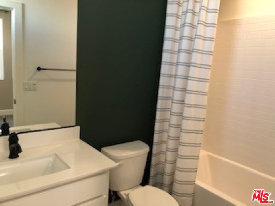 527 Daniel Freeman Circle Inglewood, CA 90301 - Photo 26 of 36 a white toilet sitting next to a bathroom sink