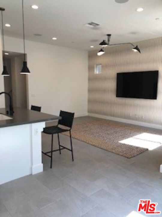 527 Daniel Freeman Circle Inglewood, CA 90301 - Photo 32 of 36 a living room with furniture and a flat screen tv