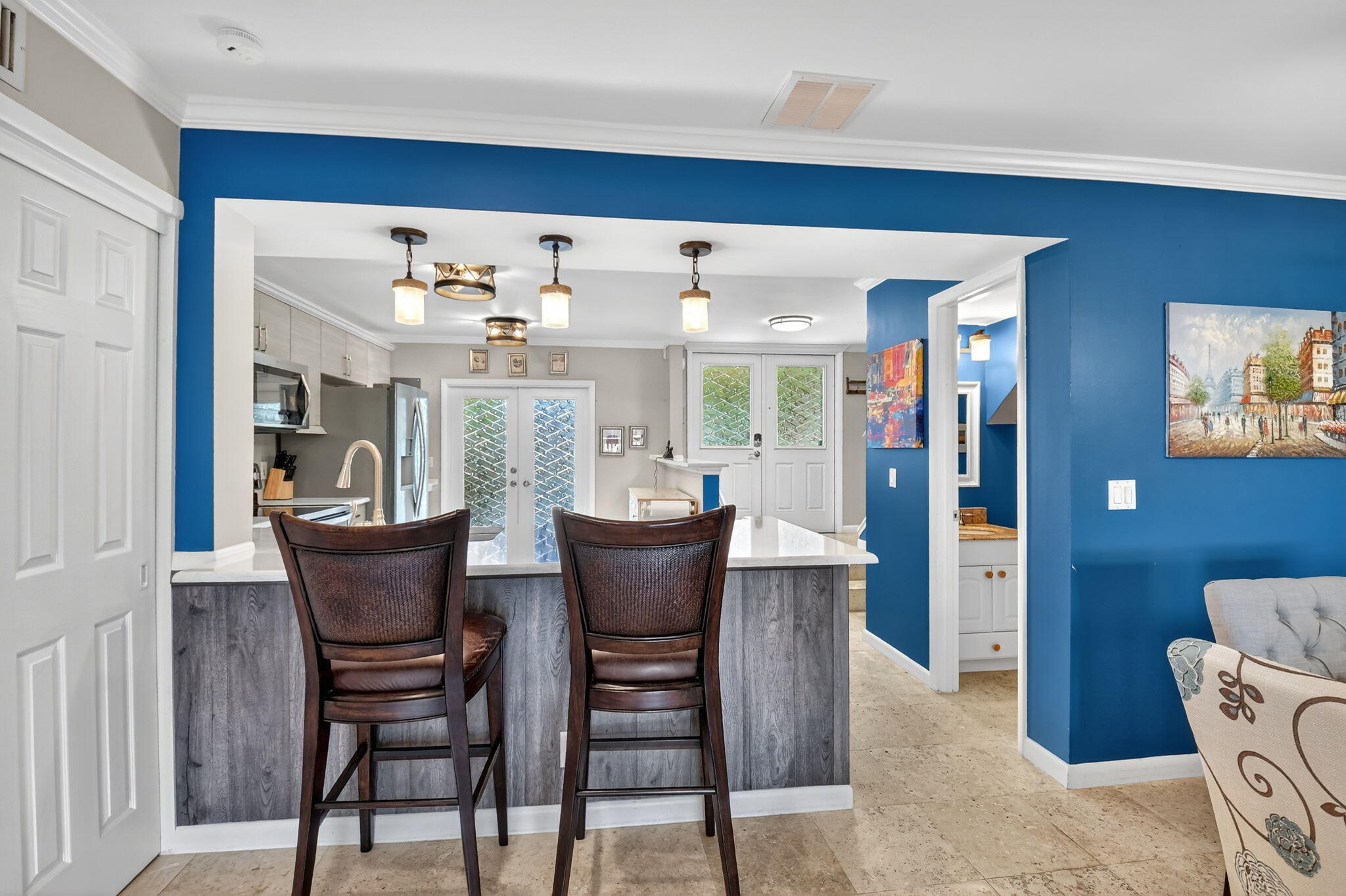 732 Rider Road Boynton Beach, FL 33435 - Photo 21 of 66 a view of a dining room with furniture and chandelier