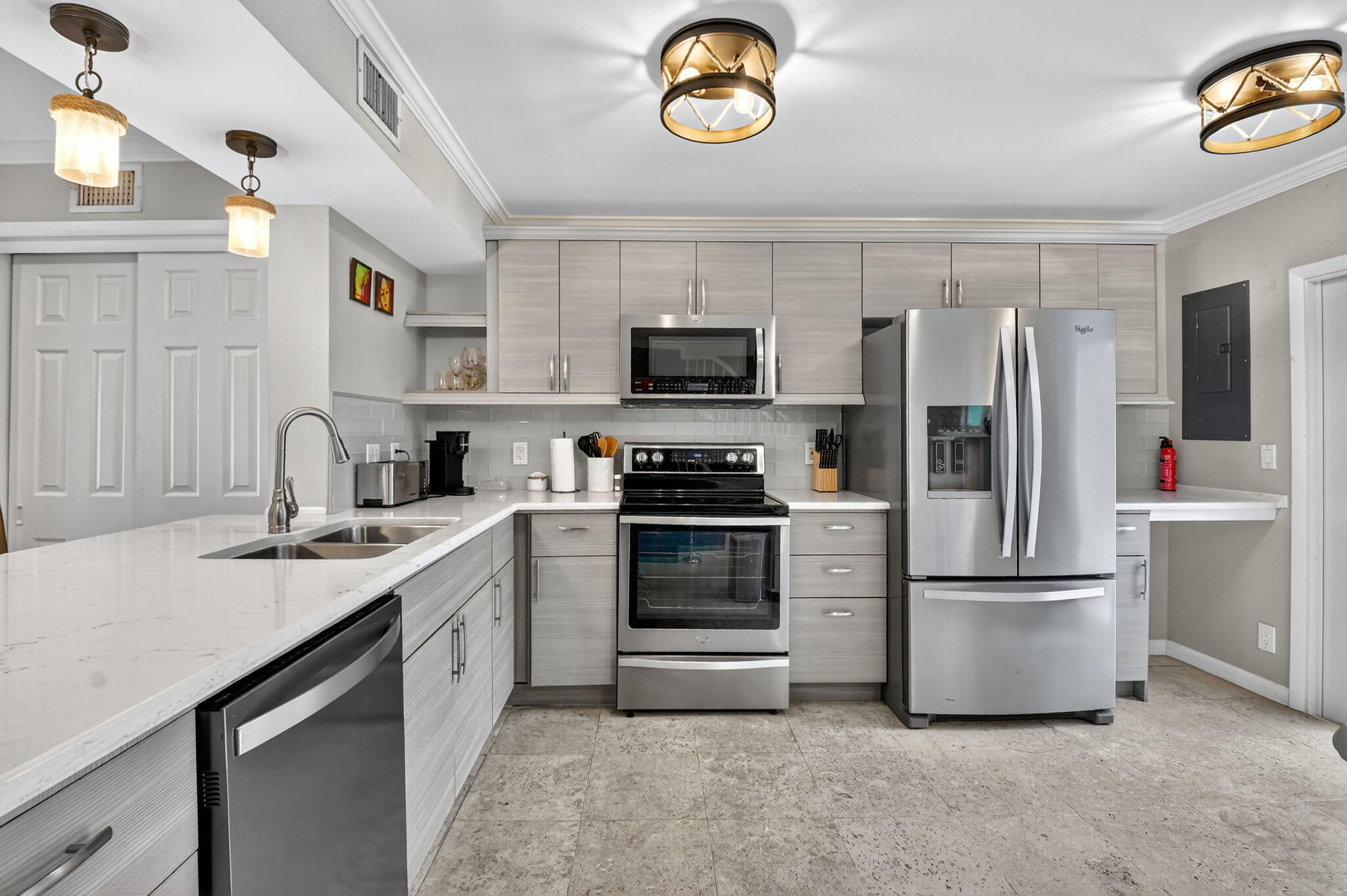732 Rider Road Boynton Beach, FL 33435 - Photo 22 of 66 a kitchen with a refrigerator and a stove top oven