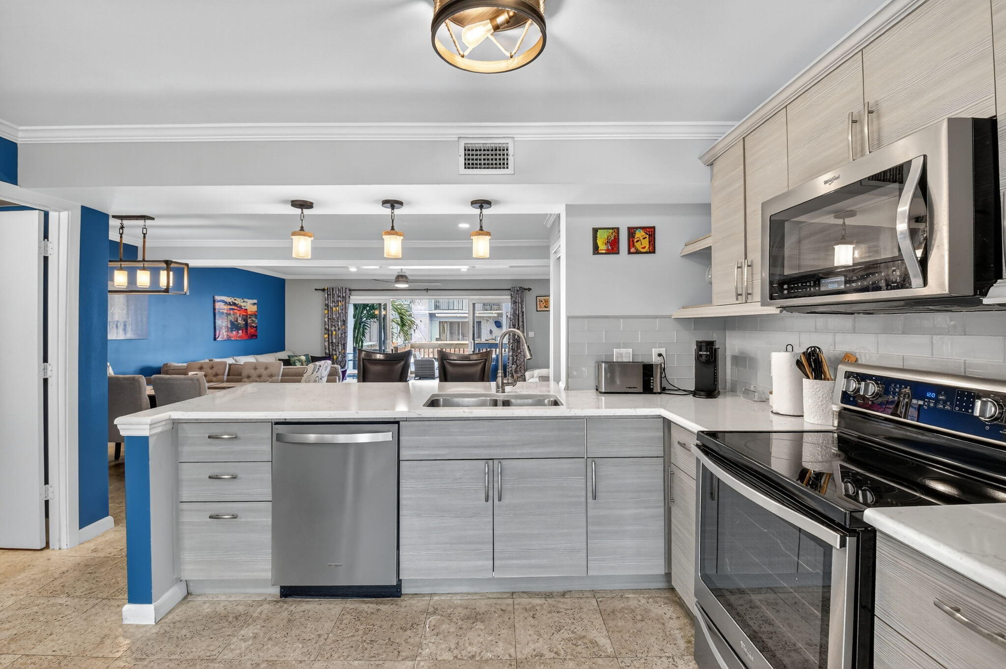 732 Rider Road Boynton Beach, FL 33435 - Photo 26 of 66 a kitchen with stainless steel appliances granite countertop a stove and a sink