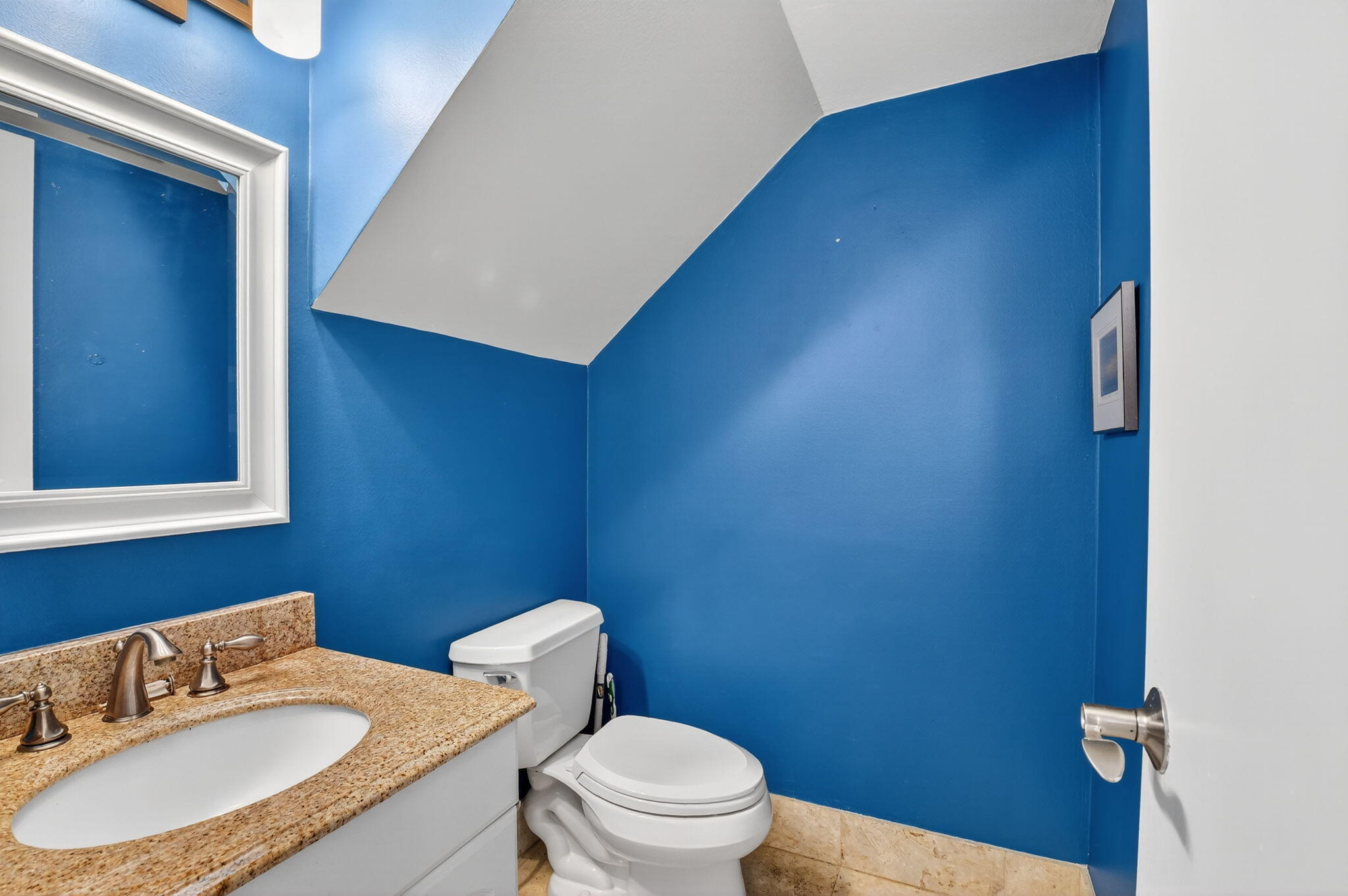732 Rider Road Boynton Beach, FL 33435 - Photo 28 of 66 a bathroom with a sink a toilet and a mirror