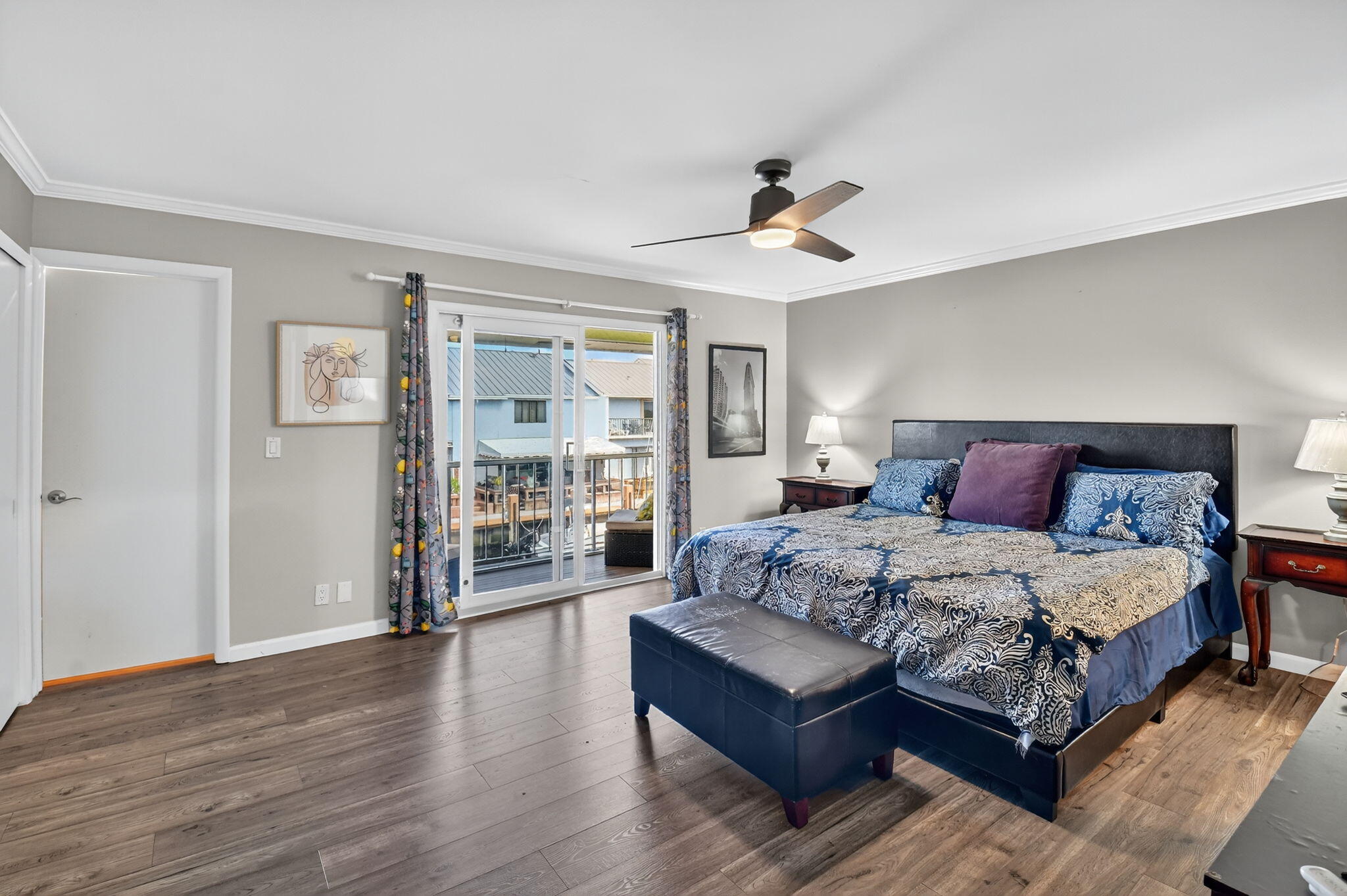 732 Rider Road Boynton Beach, FL 33435 - Photo 33 of 66 a spacious bedroom with a large bed a chandelier and a book shelf