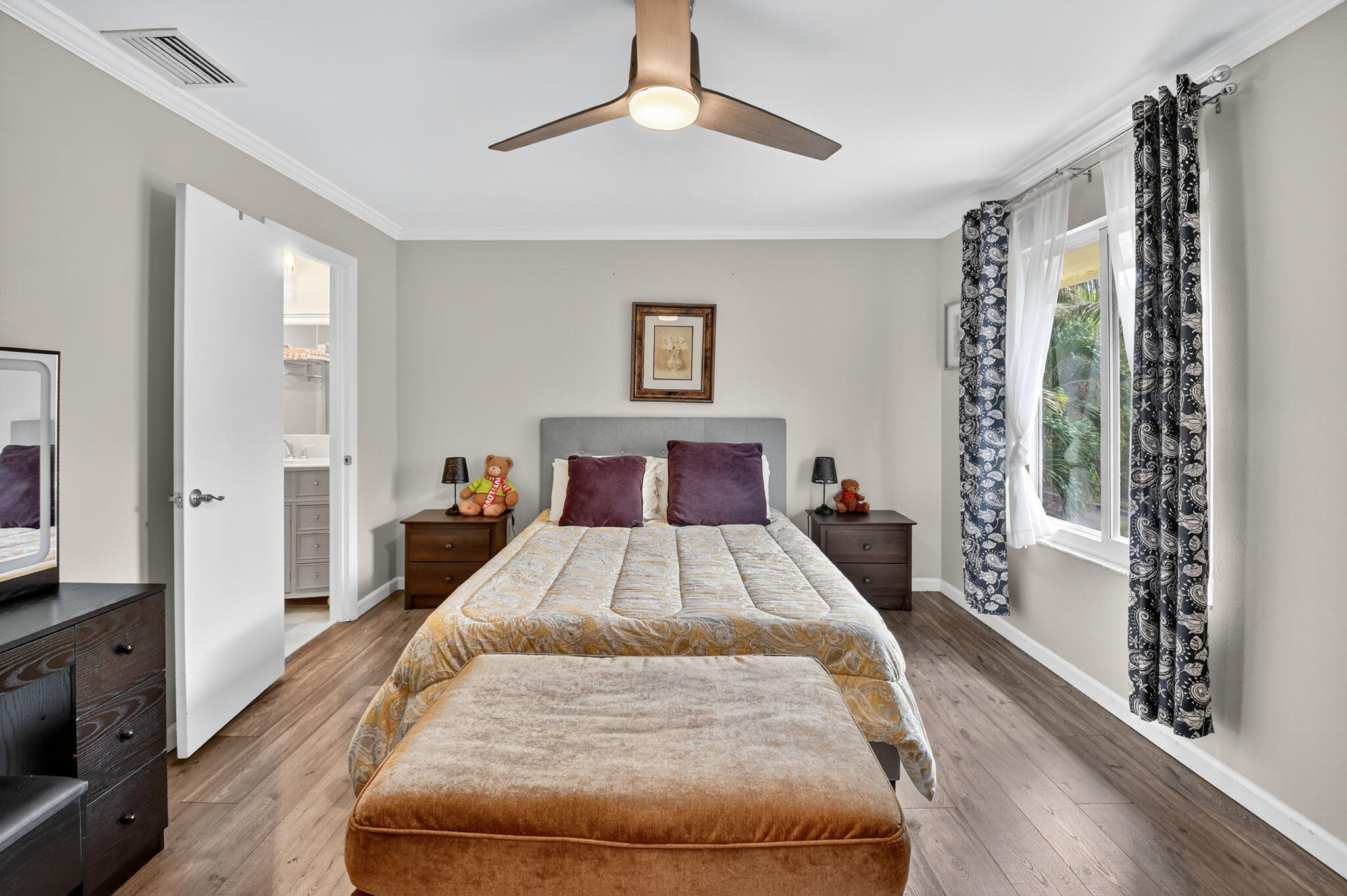 732 Rider Road Boynton Beach, FL 33435 - Photo 45 of 66 a spacious bedroom with a large bed and a chandelier