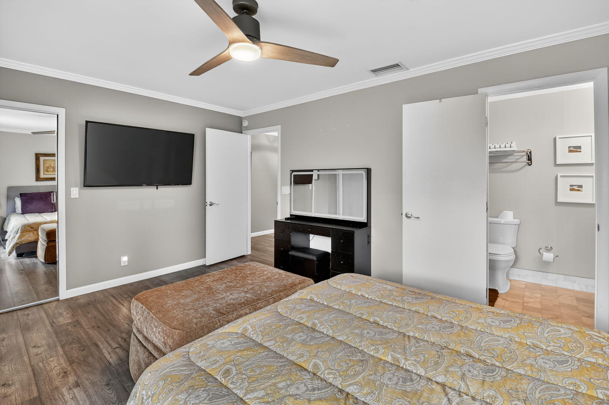 732 Rider Road Boynton Beach, FL 33435 - Photo 46 of 66 a bedroom with a bed and a flat screen tv