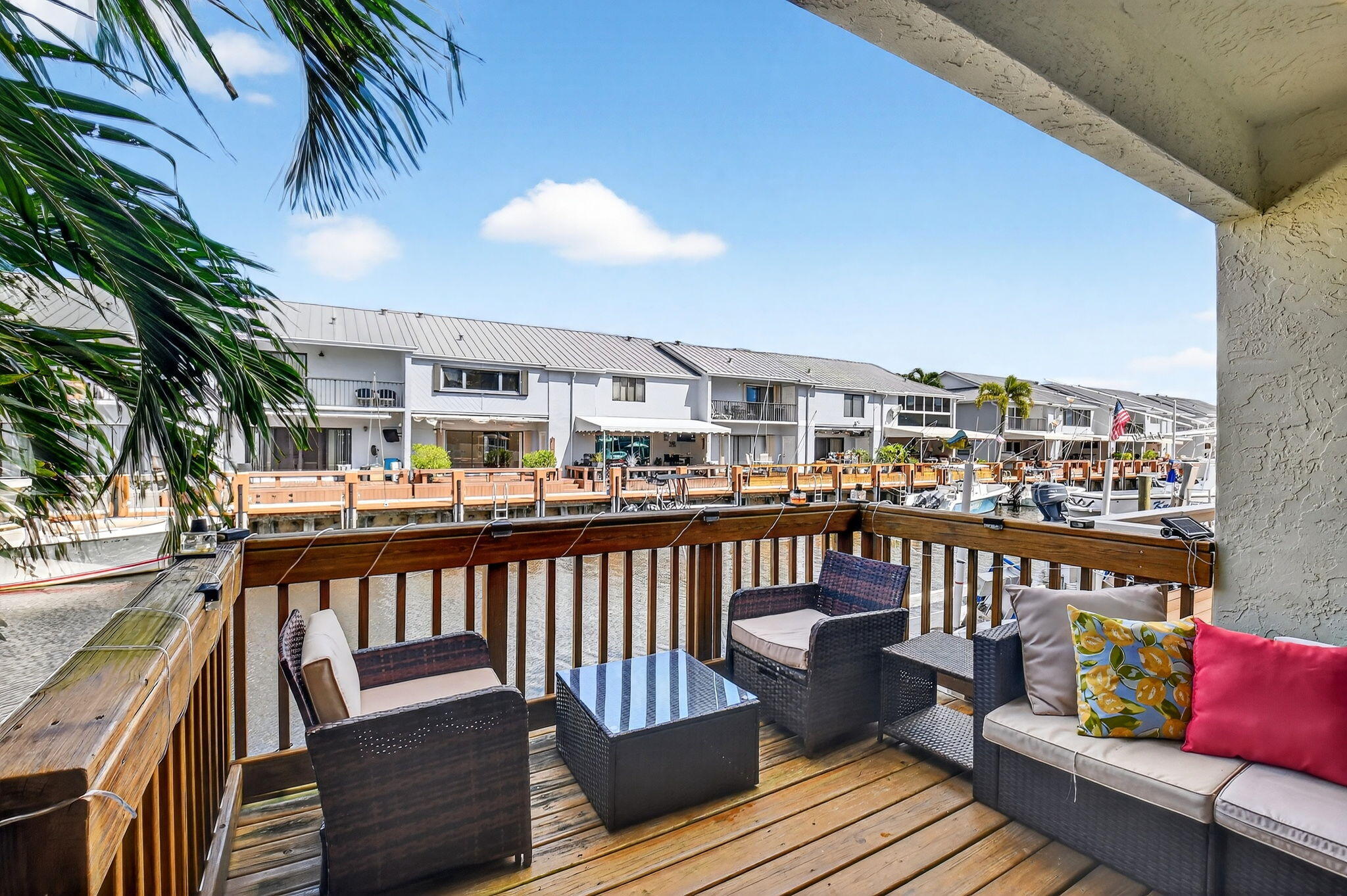 732 Rider Road Boynton Beach, FL 33435 - Photo 8 of 66 a view of a balcony with wooden floor and seating space