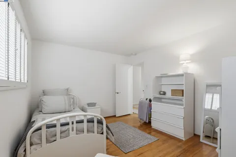 a bedroom with furniture and window