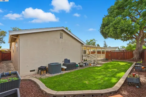 a view of a backyard with furniture