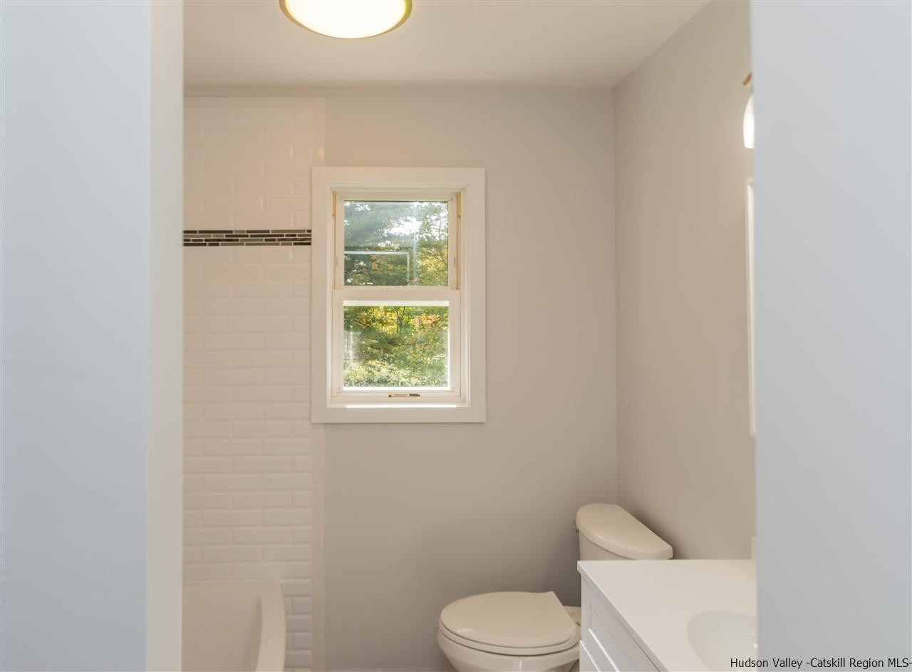 79 Kings Hill Road Walden, NY 12586 - Photo 11 of 35 a white toilet sitting next to a bathroom sink