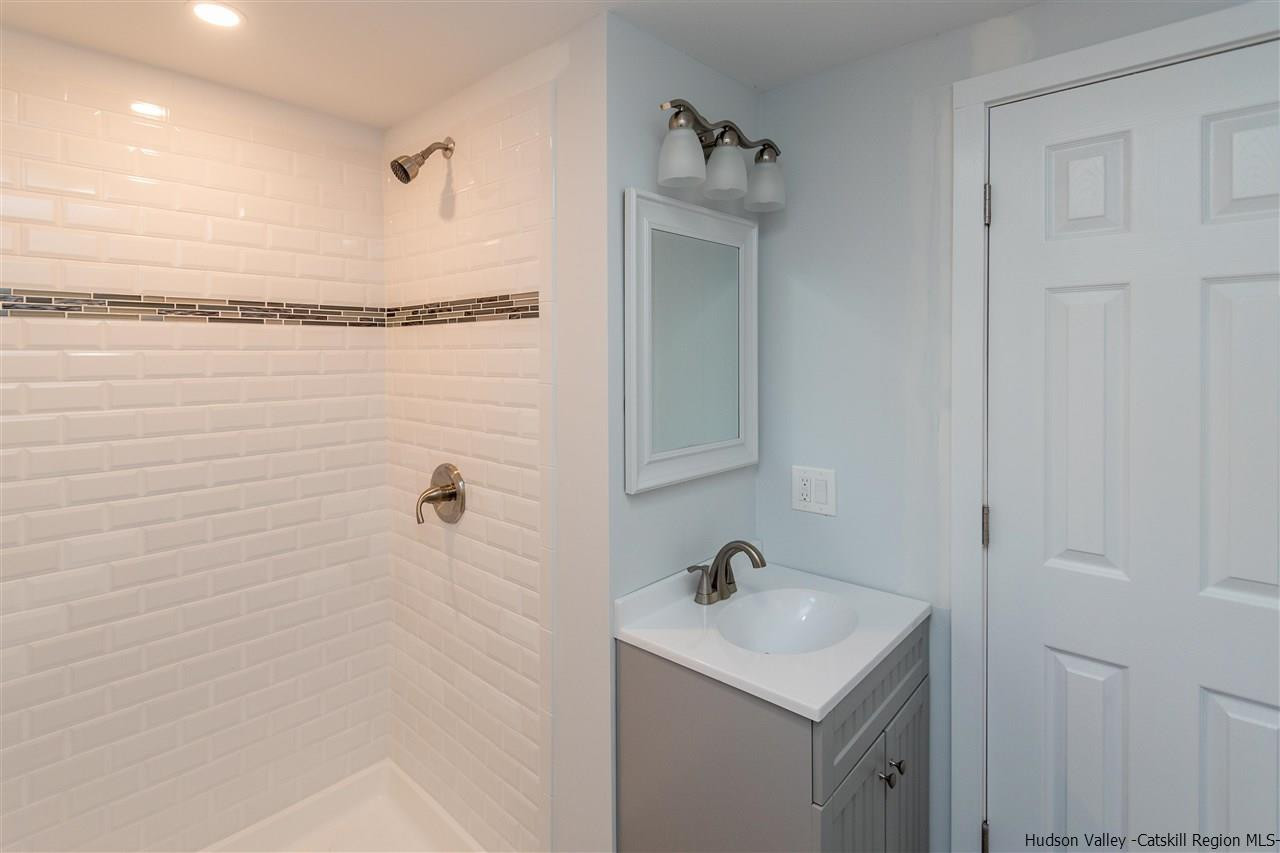 79 Kings Hill Road Walden, NY 12586 - Photo 21 of 35 a bathroom with a sink toilet and shower