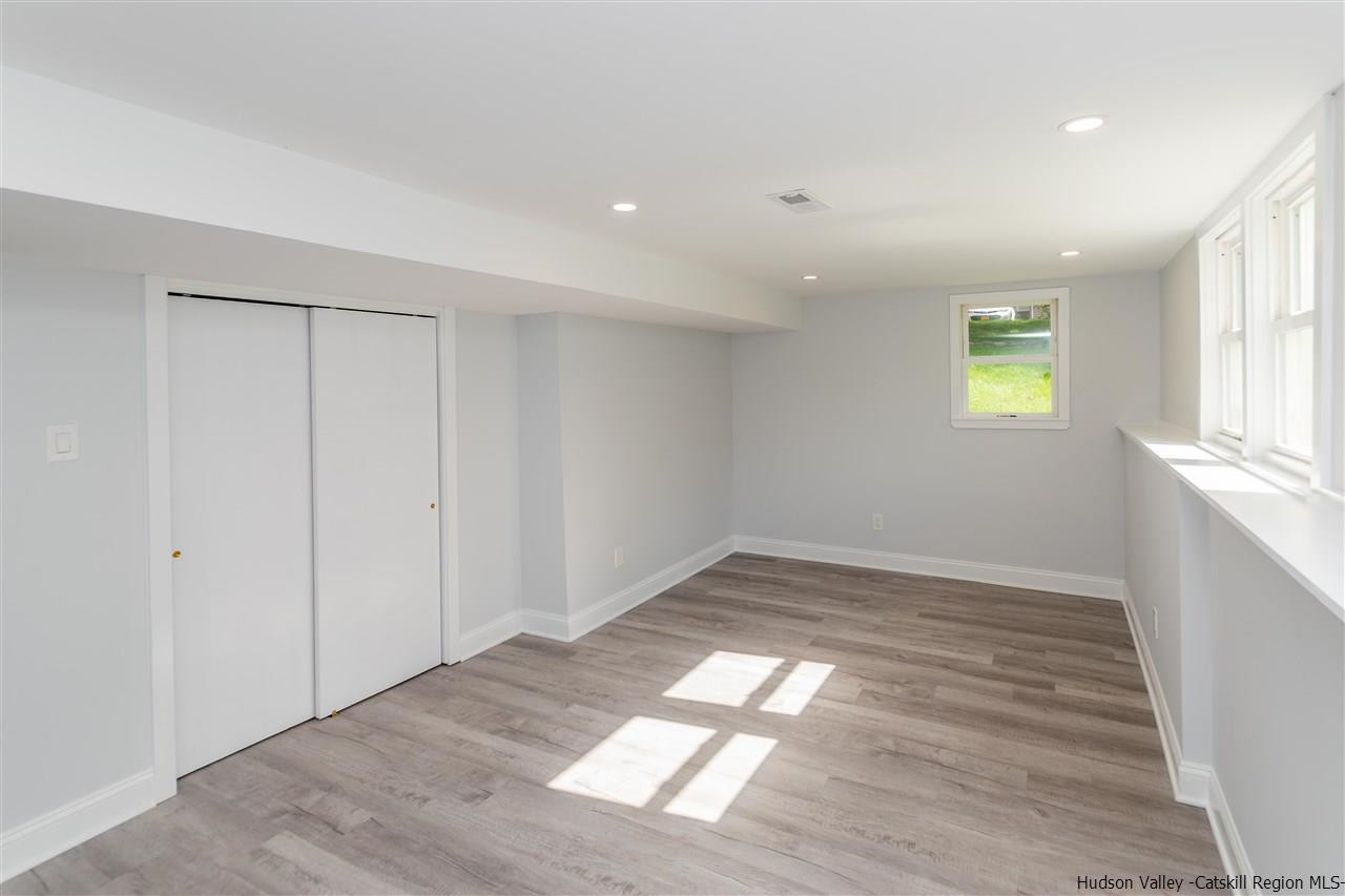 79 Kings Hill Road Walden, NY 12586 - Photo 23 of 35 a view of empty room with wooden floor and fan
