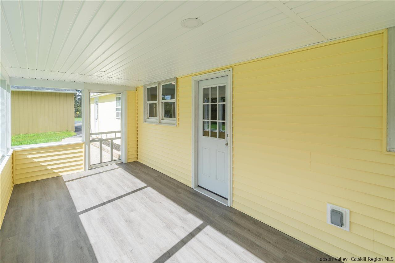 79 Kings Hill Road Walden, NY 12586 - Photo 27 of 35 a view of a big room with wooden floor and windows