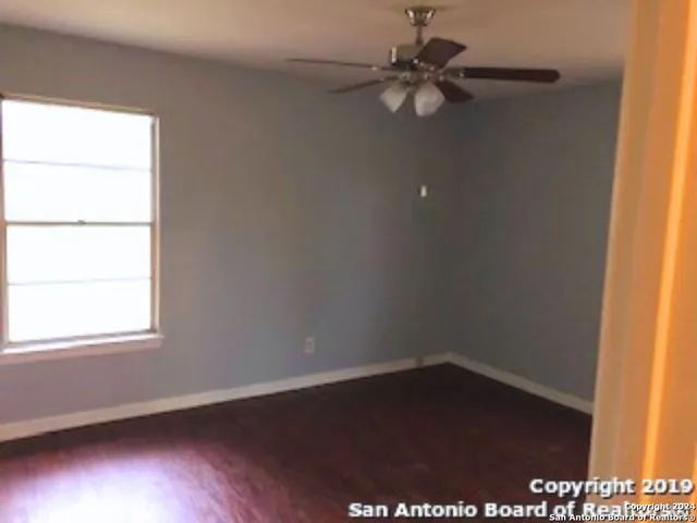 a bathroom with a sink toilet and window