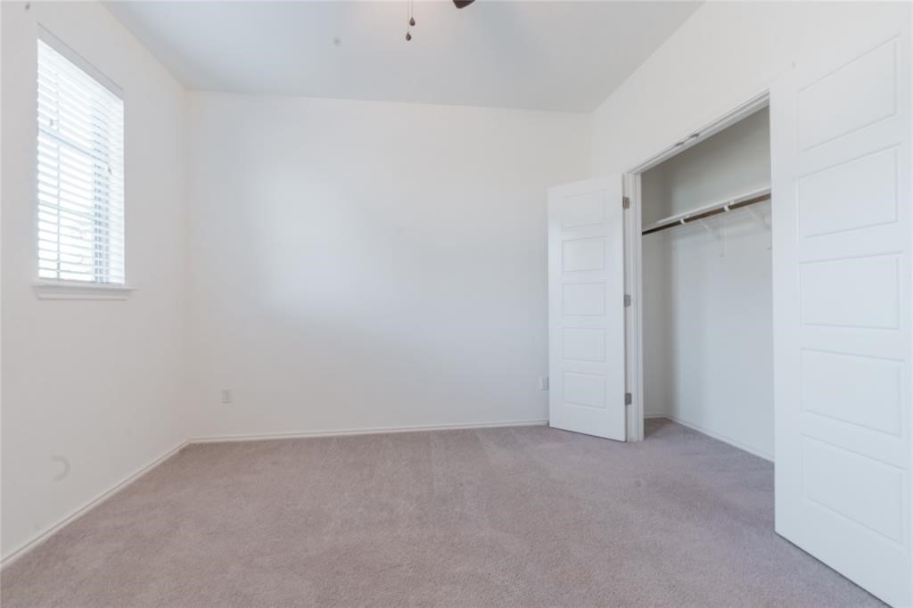 1333 Terrace View Drive Georgetown, TX 78628 - Photo 19 of 35 A spacious room offers ample natural light and a generous closet with functional storage.