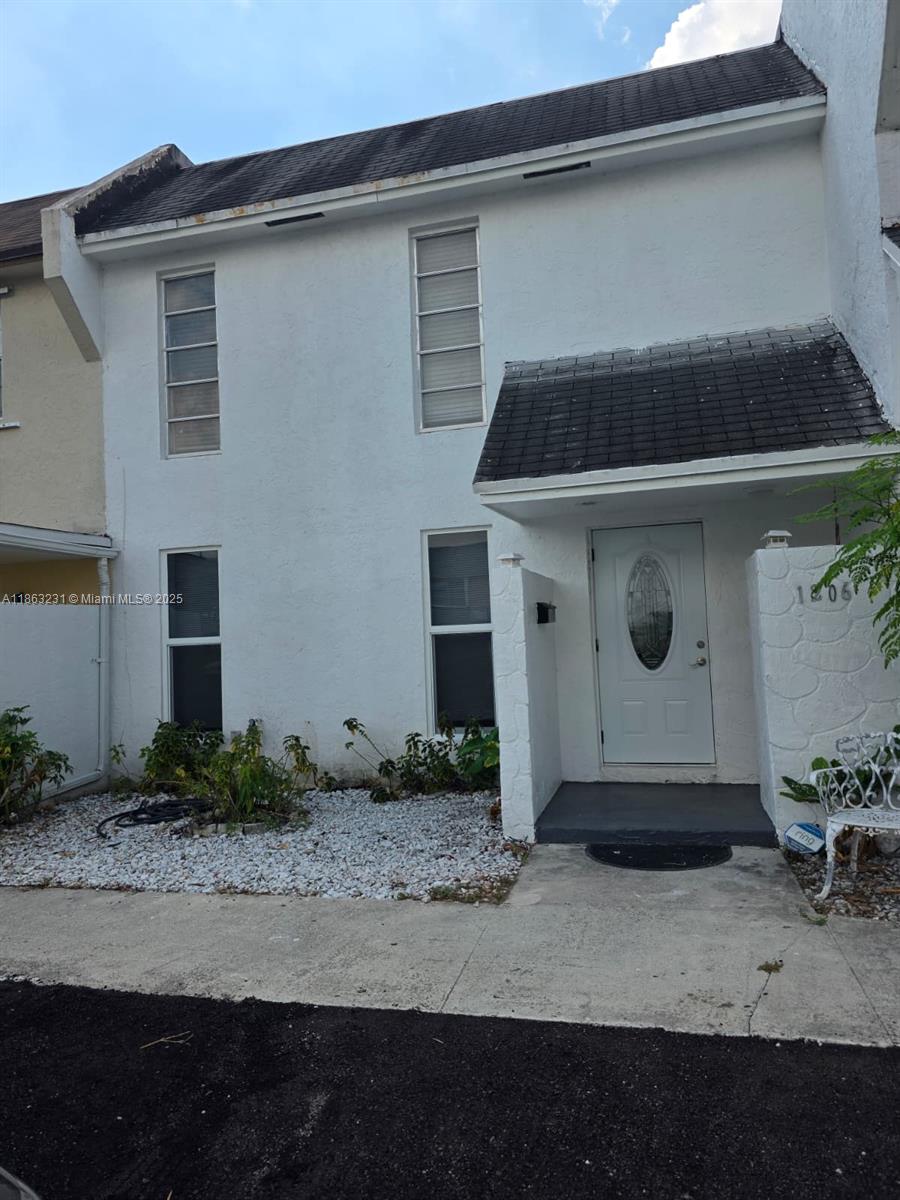1206 Seaview, Unit 1206 North Lauderdale, FL 33068 - Photo 1 of 17 a front view of a house with garage