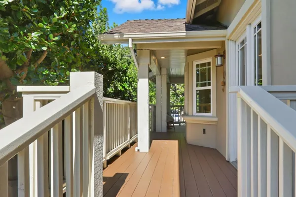 a view of a house with a small deck