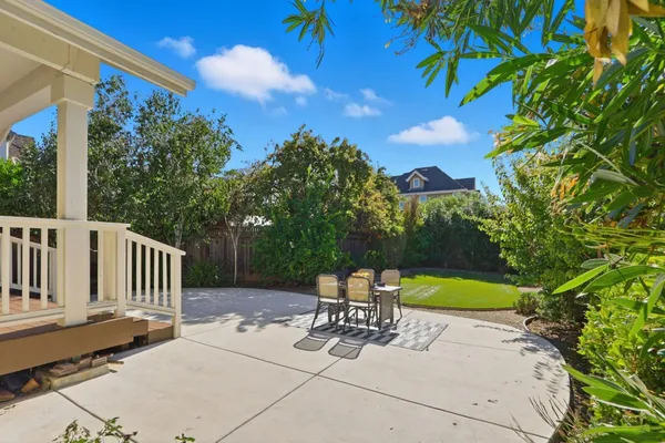a view of a chairs and table in the patio