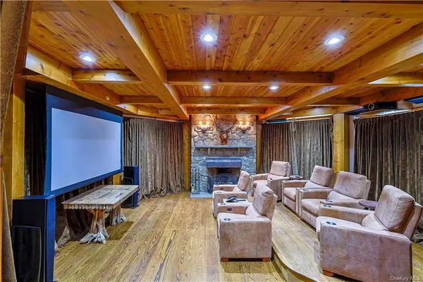 a living room with furniture a fireplace and a table