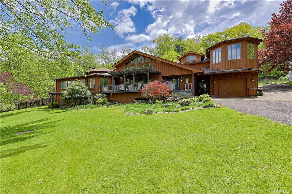295 Krumville-Davis Corner Road Olivebridge, NY 12461 - Photo 7 of 36 a front view of a house with a garden and plants